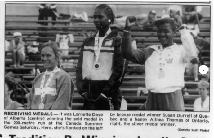Black-and-white newspaper clipping of Lornette Daye on the medal podium after winning the 200 metre sprint at the 1985 Canada Summer Games.